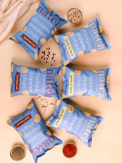 A playful arrangement of different Natch chip flavors. This kind of scattered flatlay feels energetic and is great for social media.