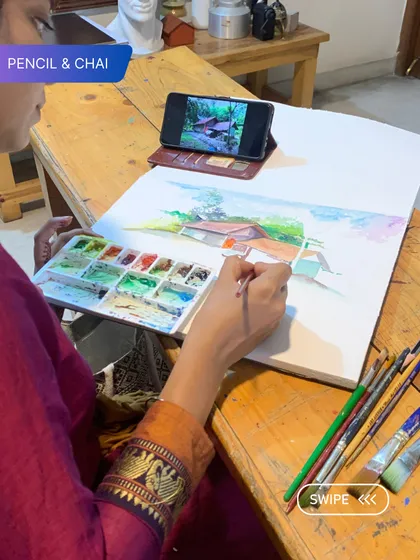 An instructor paints a landscape, demonstrating how to capture the essence of a scene with loose, expressive strokes. This is part of our hands-on teaching approach.