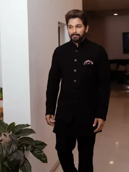 Allu Arjun in a custom-tailored black Bandhgala suit, a versatile and sophisticated choice for any formal event.