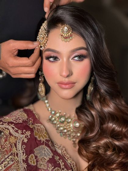 The final close-up of this stunning bridal makeup. The skin is glowing, and the eyes are softly defined, creating a timeless and elegant look.