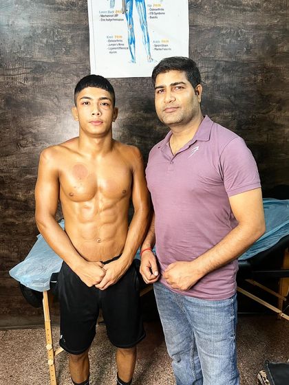 With national wrestler Love after his Graston and cupping session.