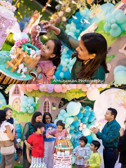 The cake-cutting ceremony is a highlight of any birthday. I ensure it's a picture-perfect moment, with the stunning themed cake and backdrop creating a beautiful scene for this happy family celebration.