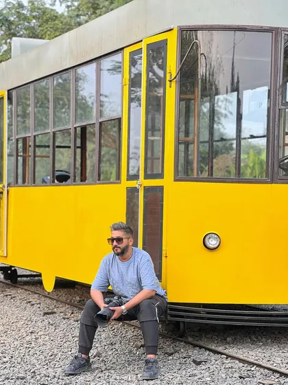 Taking a seat on the tracks, camera in hand, planning the next series of shots.