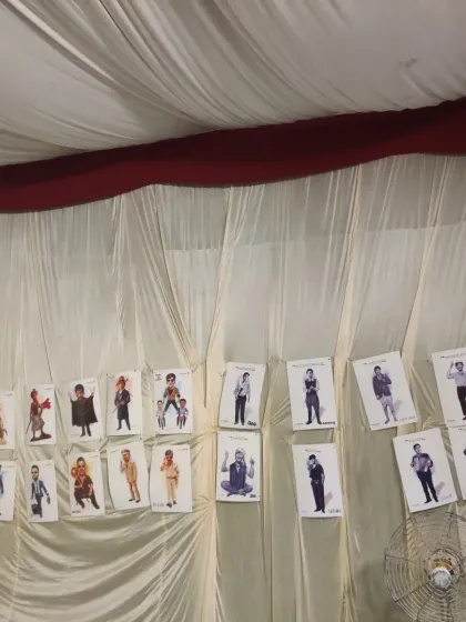 My exhibition wall featuring various celebrity caricatures at the Timeless Ayodhya Festival.