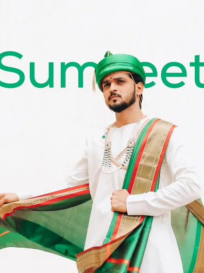 A stylish portrait of a Maharashtrian groom, showcasing his green pheta and elegant white kurta.