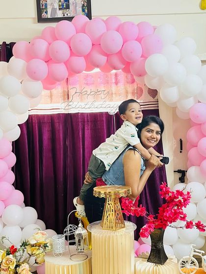 A playful moment with my son during my daughter's birthday party. The joy on his face is priceless.