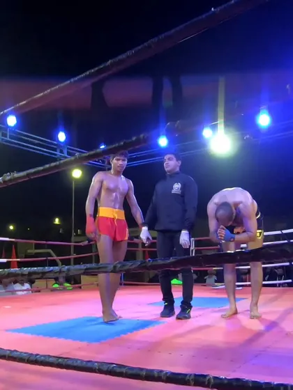 A moment of respect before the final decision. Win or lose, we honor the fight and the opponent.