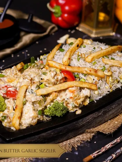 Indulge in our Creamy Chicken Butter Garlic Sizzler, a symphony of flavors that melts in your mouth with a sizzling twist.