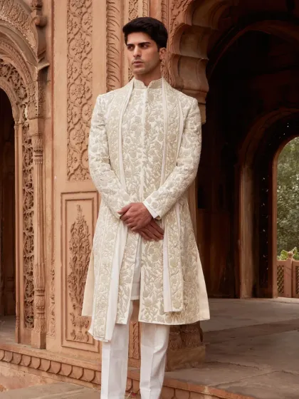 Menswear, in my view, should be about quiet confidence and impeccable detail. This ivory sherwani set is a masterclass in understated elegance, featuring intricate hand-embroidery that adds texture and depth without overwhelming the clean, tailored lines. It is perfect for the groom who values refined craftsmanship.