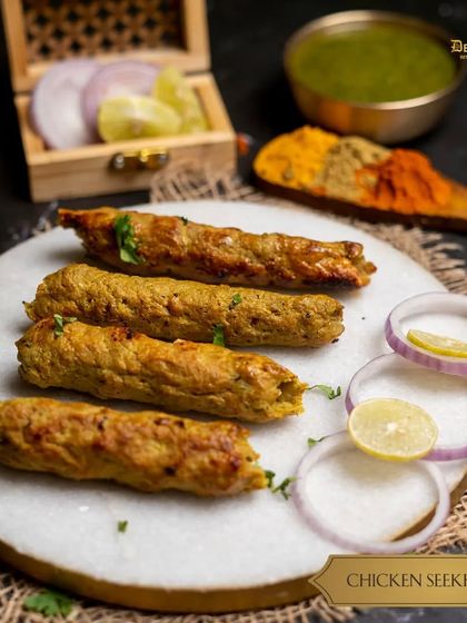 Our classic Chicken Seekh Kebab. Minced chicken is mixed with herbs and spices, molded onto skewers, and grilled until golden and juicy.