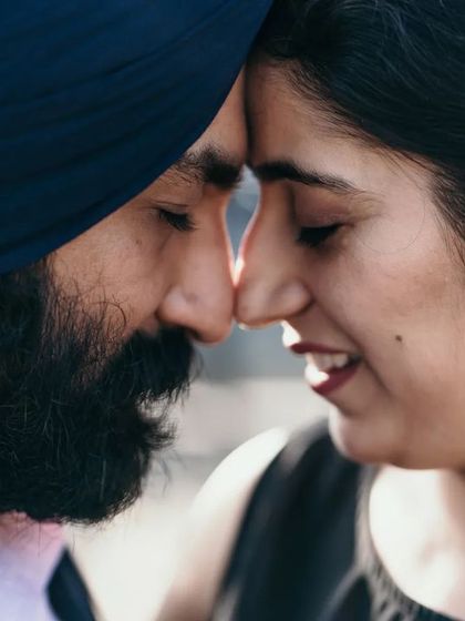 A duplicate of image 30, an intimate close-up of a couple, nose-to-nose, sharing a quiet moment.