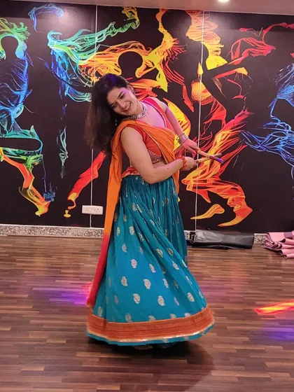 Another beautiful pose from our Garba night. The colorful outfits and vibrant music create an unforgettable experience.