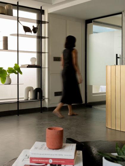 The reception area is designed as a transitional space, with clean lines and a clear path of circulation leading to other parts of the office.