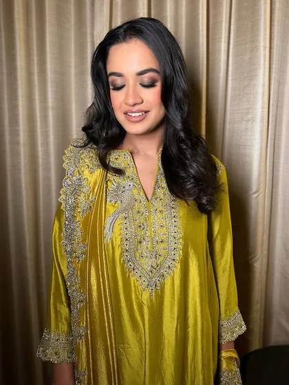 A classic smokey stare with a touch of flair. This look on a beautiful chartreuse outfit is timeless and perfect for any evening celebration.