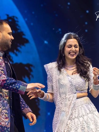 Some pictures catch those raw, irreplaceable emotions for life. This candid shot of a couple laughing mid-performance is what it's all about, the genuine joy of being together.