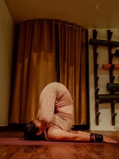 "To a mind that is still, a whole universe surrenders." A moment of deep introspection in Padma Sarvangasana, or shoulder stand with lotus legs.