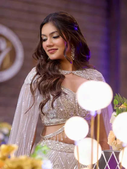 Another beautiful angle of this Sangeet look. The soft waves and glowing makeup create a dreamy, romantic vibe that is perfect for a pre-wedding celebration.