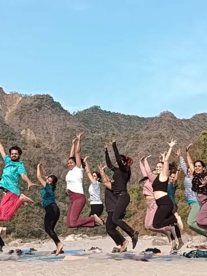 Leaping with joy. The feeling of accomplishment and freedom after completing an intensive training period in Rishikesh.