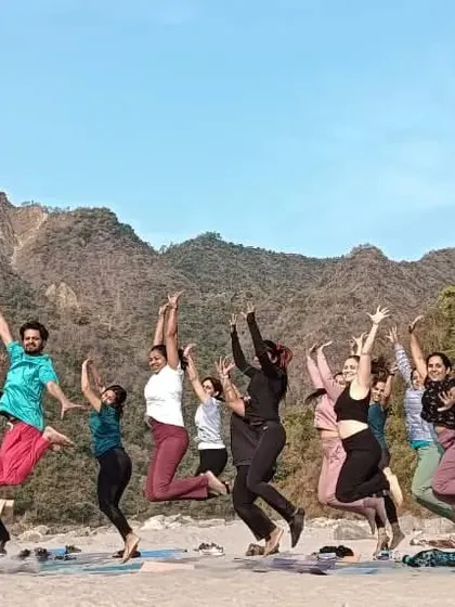 A moment of pure, uninhibited joy. Jumping for happiness on the banks of the Ganga.