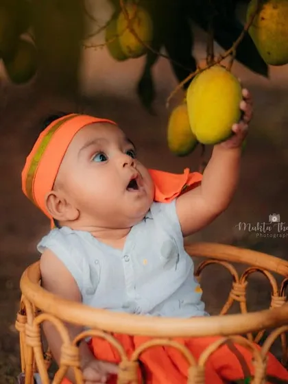 Reaching for a mango. I love capturing these interactive and candid moments during outdoor photoshoots.