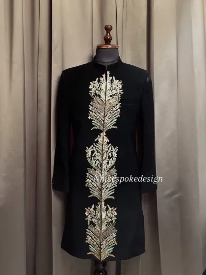 Another view of the feather-embroidered indowestern, showing the detail against a different background.