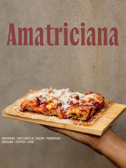The Amatriciana slice from our Pizza Romana pop-up, featuring marinara, mozzarella, bacon, and parmesan.