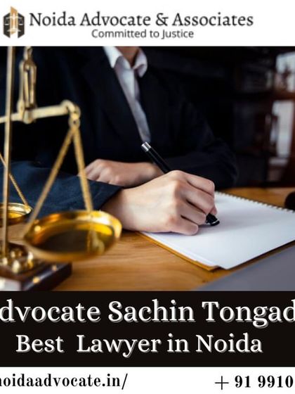 I am the best lawyer in Noida, ready to handle your case. The image of a lawyer signing documents represents my role in formalizing legal solutions for you.