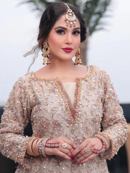 Party makeup for this beauty. The look is centered around a classic red lip and defined eyes, a timeless combination that works for any festive occasion.