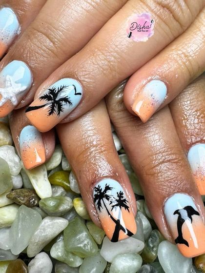 We're still not over beach nails. Here's another masterpiece with a sunset ombre, hand-painted palm trees, dolphins, and 3D starfishes.