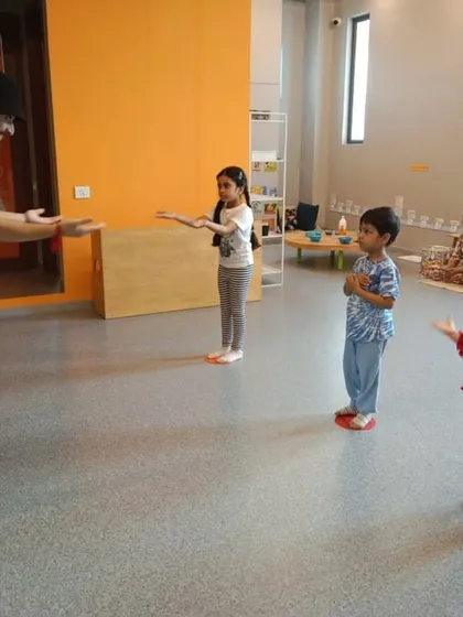 An instructor demonstrates a move for his students. We use clear, visual cues to help our youngest learners understand the steps.