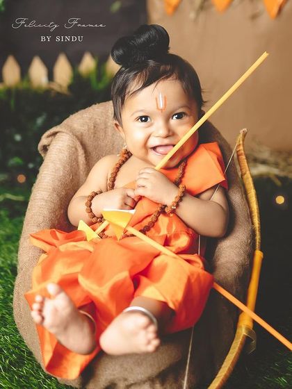 A joyful baby boy dressed as Lord Rama for a Ram Navami themed photoshoot. His happy expression and the adorable costume make for a truly special festive portrait.