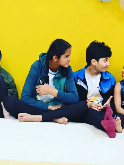 Friends sharing stories. The bonds formed here go beyond gymnastics.