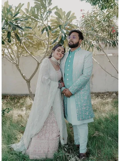 An outdoor shot of the lovely engagement couple. Her natural-looking makeup and simple hairstyle were perfect for this daytime event.