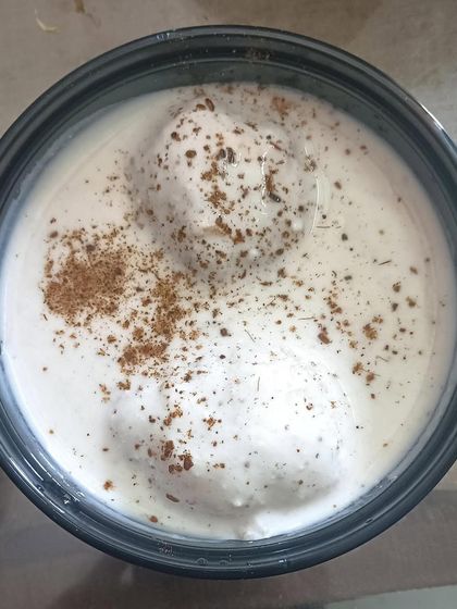 A bowl of soft and spongy Dahi Bhallas, soaked in creamy yogurt and topped with my special masala.