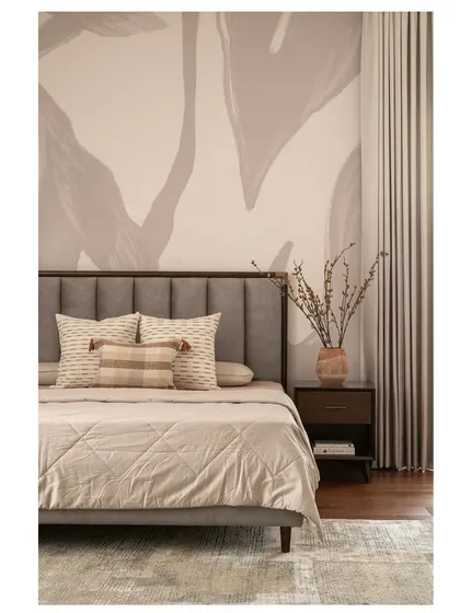 A slightly different angle of the master bedroom, showing the interplay between the soft wallpaper, the textured bedding, and the warm lighting.