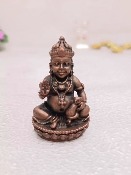 This small copper Kubera idol is believed to attract wealth and prosperity. It's a thoughtful and auspicious gift for housewarmings or new businesses.