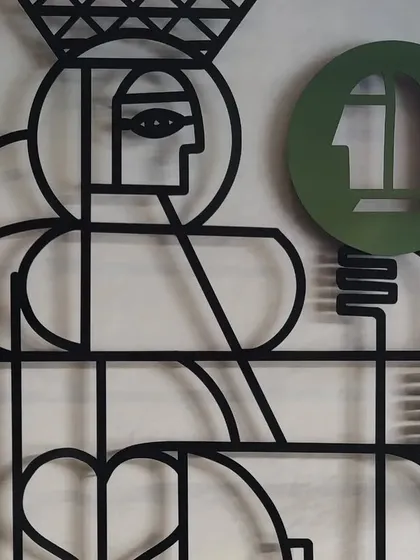 A close-up of the Queen figure, showcasing the crisp lines and minimalist design.