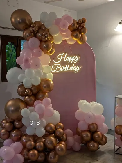 A closer look at the birthday balloon garland, showing the mix of different sized balloons that create a full and luxurious effect.