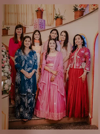 A classic group photo of the bride, Anjali, with her bridesmaids. Capturing these moments of friendship is an essential part of the wedding story.