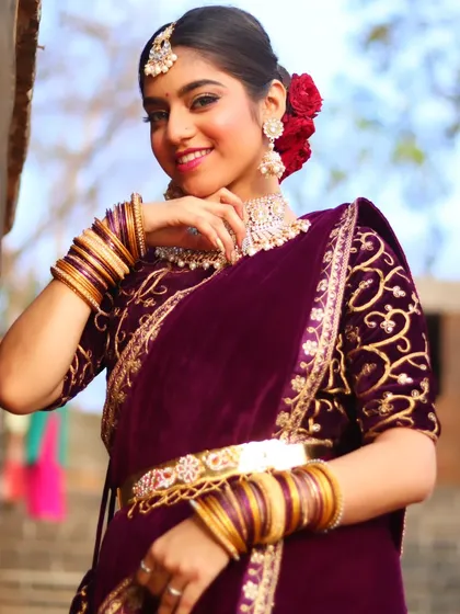 A confident and radiant portrait of the bride, ready for her reception party.