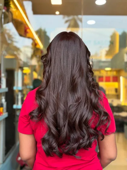 From straight and simple to wavy and rich. This before-and-after shows how a global color and some styling can completely transform your look.