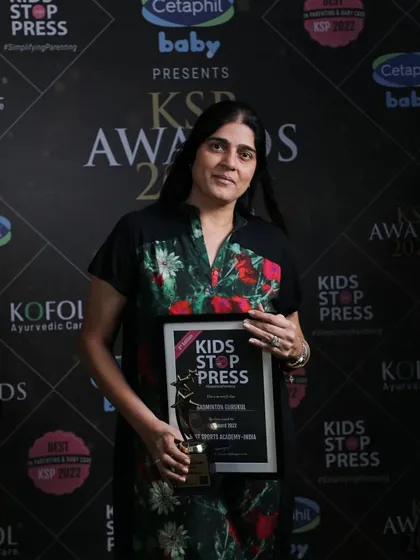 Our Founder & MD, Ms. Supriya Devgun, holding the KSP Award for Best Sports Academy.