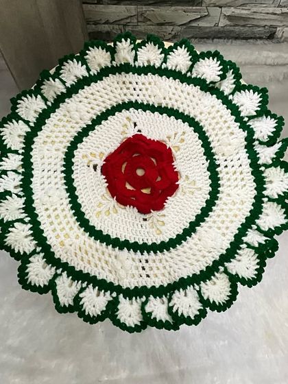 A top-down view of the rose-themed 'Tatavaracha Rumal'. The stitchwork is intricate and inspired by designs my Aaji used to make.