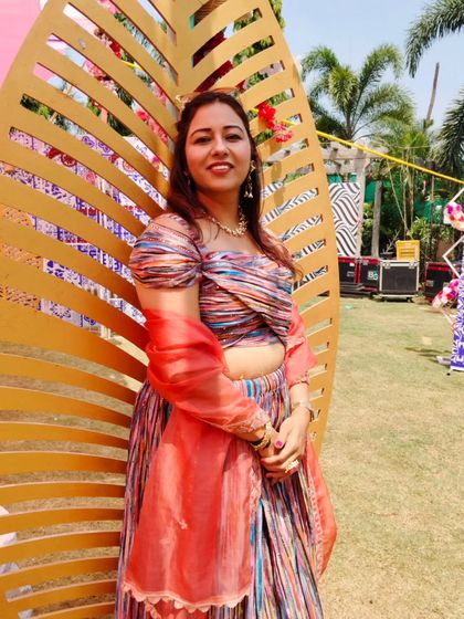 A candid smile during a Haldi ceremony. I truly love what I do, and I think it shows in my energy and interaction with guests.