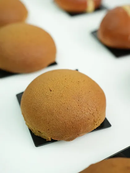 These are classic coffee buns, also known as PappaRoti buns. We teach you how to create the signature crispy coffee topping that covers a soft, buttery bun on the inside.