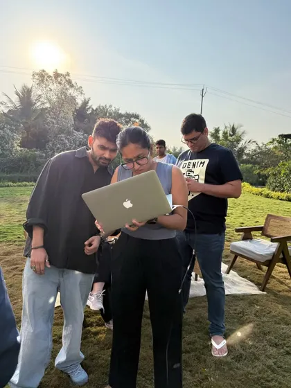The on-set review is a crucial part of the process. Here, the team and I are checking the images on a laptop to make sure we are aligned with the client's vision.