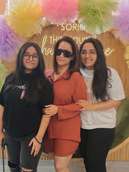 A mother and her daughters spending quality time together at the salon. I am proud to offer a space where families can come to relax and bond.