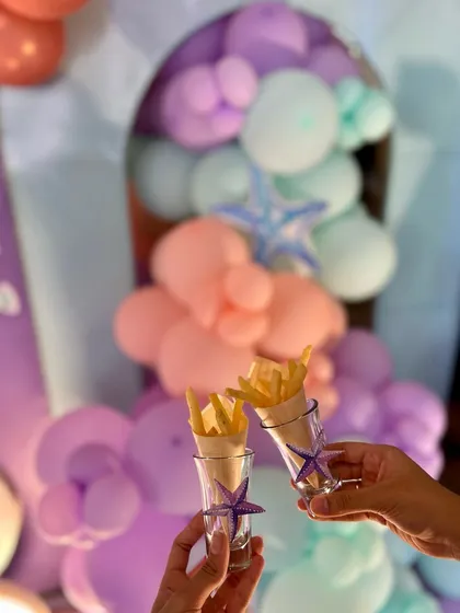 French fries served in individual glasses, a classic kid-favorite presented with a touch of style for the mermaid party.