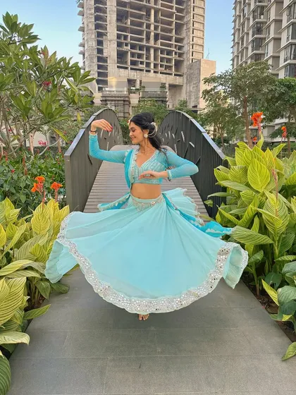 A series of photos capturing the twirls and graceful movements of semi-classical dance. The flow of the lehenga is essential to the visual beauty of this style.