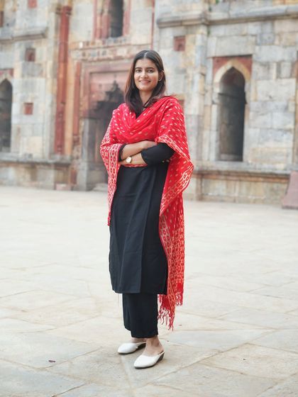 A full-length shot showcasing the complete traditional outfit against the backdrop of Lodi Garden's architecture. This type of portrait is great for showing the entire look and feel of the attire.